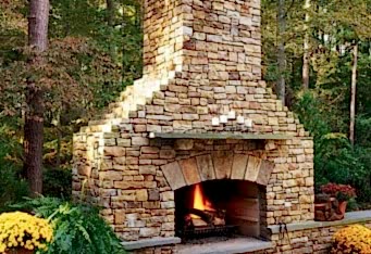 Custom Stone Fireplace completes a Backyard Design by GA Landscape Design