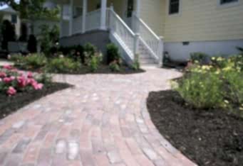 Brick Walkway with flowers around in this Westfield NJ landscape