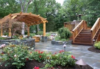 Blue Stone Patio with stone walls complete the landscaping of this Westfield NJ backyard