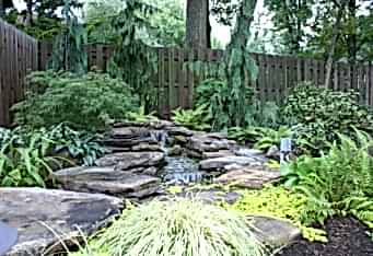 A custom landscape design with a Water Feature in Westfield NJ