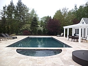 Clean lines and dark lining with a natural stone surround create a luxurious place to take a swim