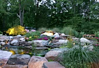 Landscape Lighting enhances a waterfall in a Scotch Plains NJ backyard design