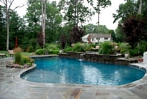 Custom Pool design completes the backyard landscape at this home